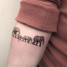 Pin On Home Decor Tattoos For Women Elephant Family Tattoo Fineline Tattoo