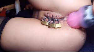 Fisting of Anal when Caged Pierced Pussy Closed by Padlock