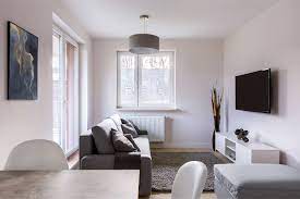 Bold and contrass color wall paint make this room attractive even without many decorative/ornamnets. How To Make Any Room Look Bigger With Paint Paintzen