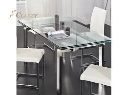 Stainless steel is bluish grey in color and due to it being an alloy, casts a highly lustrous shine and looks pretty in the kitchen and even on the dining table. Tempered Glass Top In Stainless Steel Base Dining Table Metal Table