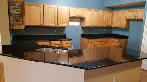This model's attractive granite top is supported by a 3/4 plywood core, making it more affordable, lighter, and easier to move than full granite tabletops. Uba Tuba Granite Countertops Pictures Cost Pros Cons