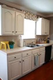 White Painted Cabinets With Distressed Finish Danish Oil Used For Distressing Kitchen Cupboard Redo Kitchen Cabinets Distressed Kitchen Cabinets