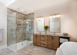 Open bathroom shelving holds a menagerie of framed grey and white bathroom pictures elegantly decorate a tiled cistern box. Bathroom Gallery Grey And Brown With Warm Wood Vanity