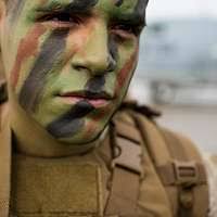 U.S. Marine Corps Cpl. Jerome Christian, with Weapons
