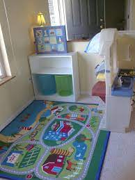 Bookshelf With Mesh Storage Baskets Underneath Home Daycare Kids Daycare Daycare Spaces
