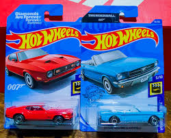 Red, as a, gold hot wheels 30th anniversary logo on rear fender, ww, mal. Bond James Bond 71 Mustang Mach 1 65 Mustang Convertible Hotwheels