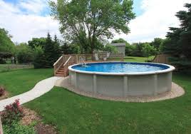 River rock adds a decorative touch to your above ground swimming pool. The Cover Photo Is Great Except We D Need A Gate To Prevent Little From Going U Backyard Pool Landscaping Above Ground Pool Landscaping Best Above Ground Pool