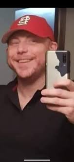 A member of the Hardriders, the first all African-American all  Harley-Davidson Motorcycle Club in Houston, shouts to a friend as he heads  down the Galveston Strand. Saturday of the 2023 Lone Star
