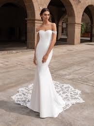 They are a great option for ladies after a gown that's a little shorter than your typical wedding dress, finishing between the knee and black lace wedding dresses. Off The Shoulder Crepe Fit And Flare Wedding Dress With Lace Accented Train Kleinfeld Bridal
