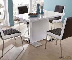 An expandable solid wood dining table is both functional and stylish, while the armless dining chairs include comfortable cushions and neutral colors that will go with any decor. Small Dining Table To Maximize Small Dining Room Recous