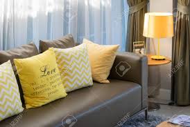 Browse through an unparalleled variety of brown sofa with cushion in fresh and unpredictable styles, and choose from trendy items or classic pieces. Modern Living Room Design With Brown Sofa And Yellow Pillows Stock Photo Picture And Royalty Free Image Image 38592698