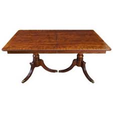 Item features banded and inlaid large square top with rounded corners, brass rolling paw feet. Duncan Phyfe Dining Table 7 For Sale On 1stdibs