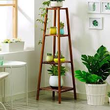Nothing some wood dowels and hot glue cut three wooden blocks to act as the legs of the stand depending on the size of your base vessel. Top Tips For Arranging Indoor Plants Family Handyman