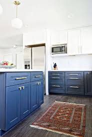 This Wood Floor Isn T Wood At All A Cheap Durable Alternative To Hardwoods Apartment Therapy Main Kitchen Cabinets Decor Navy Kitchen Cabinets Kitchen Remodel