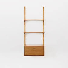 Perfect for displaying those treasures, this attractive walnut display cabinet has plenty of storage. Mid Century Wall Shelving Cabinet Set