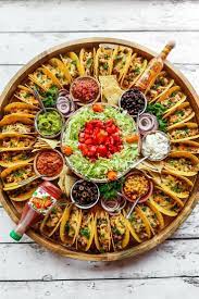 For your next holiday party, serve up one (or a few) platters overflowing with surprising and delightful flavor combinations. Fingerfoodrezepteschnell Partyrezepteschnelle Einfachegerichte Snacksfurparty Grillenrezepte Easy Taco Recipes Party Food Platters Party Food Appetizers