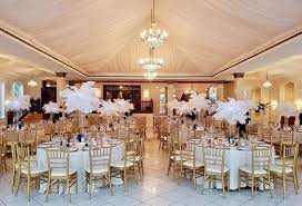 Lighting, drapery, dance floor rentals, vinyl dance floor covers, aisle decor, arches, chuppahs, hanging ceiling treatments and more. Feather Centerpieces Ags Event Creations Wedding Rentals