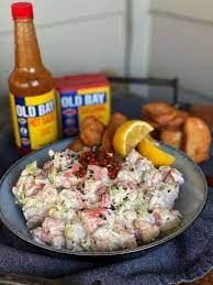 In a large serving bowl, toss together the potatoes, eggs, crabmeat, black olives and carrot. Snow Crab Salad Salads Fish And Seafood