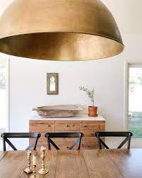 Farmhouse Dining Room With Huge Brass Dome Light Fixture And Buffet With Vintage Stylin Dining Room Lighting Dining Room Buffet Styling Modern Farmhouse Dining