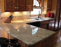 The all white surface of this stone is accented only by the dark flecks of black. Ornamental Guidoni Granite Kitchen Countertops Wall Cladding