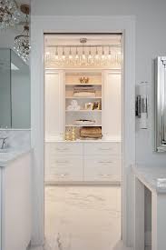 This bright modern closet is accessible from the home's bathroom. Closet In Bathroom Design Ideas