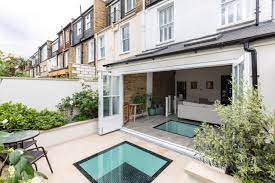 Natural light will open up your space and take your basement from dark and dreary to bright and inviting. Rear Bi Fold Doors And Light Wells To Basement British Colonial Patio London By Croft Structural Engineers Houzz