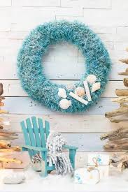To do this, start by tying the normal crisscross you would make to tie your shoe, then just do it again in the opposite direction. Easy Upcycled Coastal Christmas Wreath 12 Wreath Ideas Sustain My Craft Habit