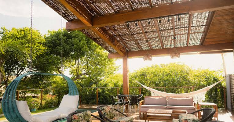 How Motorized Pergola Shades Protect Outdoor Furniture From Sun Damage