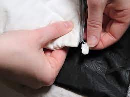 Here are 3 things that you can use for a zipper stop: Zipper Insertion Pin Replacement Ifixit Repair Guide