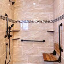 Before installation, safety grab bars should be tested in a handicap accessible bathroom in order to ensure they are installed at the proper height and secured to wall studs to support a user's weight. Grab Bars For Bathrooms Disability Remodeling Homeaccessremodeling Com