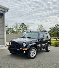 Image result for Brilliant Black 2003 Jeep