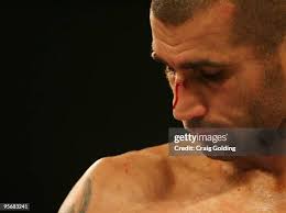 Robert Medley throws a punch at Anthony Mundine during their WBA... News  Photo