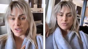 Kim Zolciak flashes her chest with reality TV producer Troy VanderHeyden