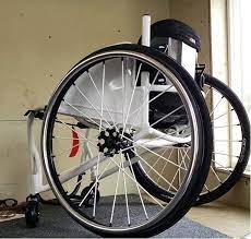 spinergy xslx cross laced sport light extreme wheelchair wheels on a custom built box chair featuring white spokes black axle so durable 車