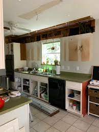 I am painting the kitchen cabinets and the soffit the same color to make them blend together (you can see the finished painted cabinets in this post and the totally finished diy kitchen makeover here), but this post is. Orc Budget Kitchen Makeover Removing Soffits And Sheetrock Patching House Homemade