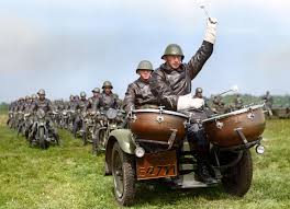 WW2 Colourised Photos - A line-up of Dutch military motorcyclists led by a three-wheeled motorcycle with timpanist during an inspection, held by Major General Van Nijnatten, Commander III Army Corps, for the