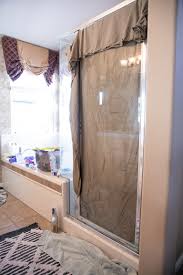 How To Remove Hard Water Stains From Glass Shower Doors The Forked Spoon Hard Water Stain Remover Glass Shower Glass Shower Doors