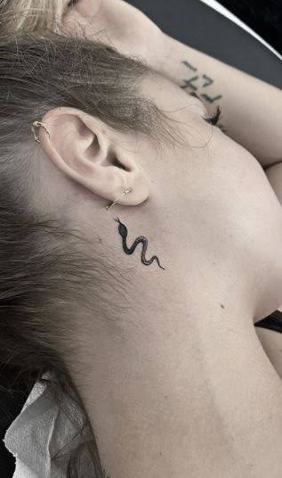 75 Trendy Snake Tattoos Designs, Ideas and Meanings - Tattoo Me Now | Small snake tattoo neck, Simple nick tattoo, Snake tattoo design