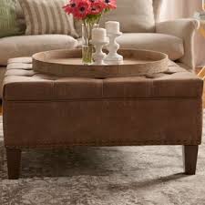 The classic espresso brown leather like upholstery makes this storage bench suitable as a coffee table ottoman in a living room or family room, or as extra seating in a study. Leather Coffee Table Ottoman Wayfair Ca