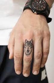 Tatouage de loup aux yeux bleus sur avant bras foret et riviere en pleine lune. Tatouages De Loups Pour Hommes Animal Totem Shop
