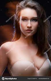 Beautiful mixed race Asian girl with big breasts, wearing a bra Stock Photo  by ©alextorb 320393170