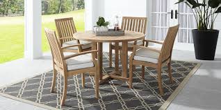 Our solid teak dining tables come in a variety of styles + shapes (oval, rectangular, round, square). Pleasant Bay Teak Tan 5 Pc Round Outdoor Dining Set Rooms To Go