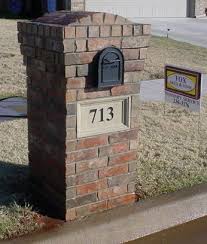 Decorative and functional brick mailbox with red bricks, white top and black metal box. Mailboxes Masonry Brick Or Stone Brick Mailbox Mailbox Landscaping Mailbox On House