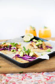 In a large bowl toss together fish, tomatillos, oil, garlic, orange peel, and lime peel. Fish Tacos With Cabbage Slaw And Gluten Free Tortillas Food Matters