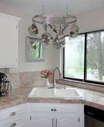Most designers will put a window near the kitchen sink because washing dishes could be one of the most boring activities. Modern Small Space Kitchen Sink Design Novocom Top