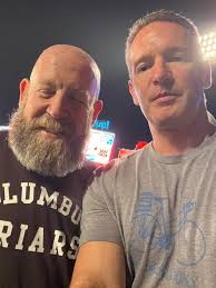 Dook fan in crew jacket and hat