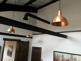 The metal caps at the top are offered in three finish options to match your cabinet hardware. Copper Pendant Lighting Elevates Industrial Office Space Inspiration Barn Light Electric