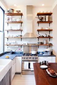 Square kitchen layout with cabinet above stove white kitchen cabinets and black sink, faucet and hardware modern french country kitchen with stylish cabinets over stove The Kitchen Design Decisions That Drive Our Readers Crazy Kitchn