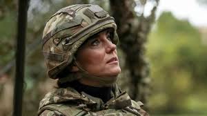Camouflage Kate drives armoured vehicle with machine gun at Queen's Dragoon  Guards