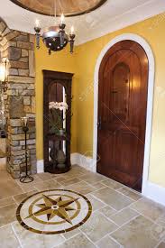 Don't really like the actual rug. Arched Front Door And Ceramic Tile Entryway Of Luxury Home With Stock Photo Picture And Royalty Free Image Image 6427756